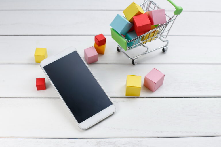 cell phone and shopping cart , Online shopping , mobile shopping concept